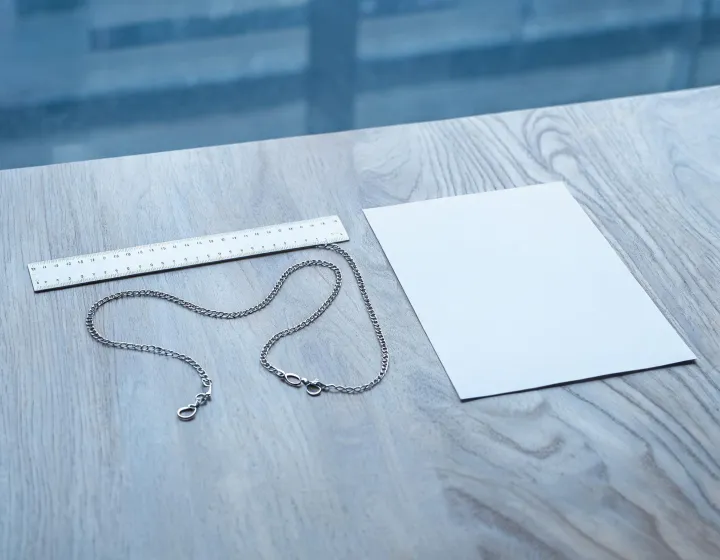 Unbranded eyewear chain beside a millimetre ruler